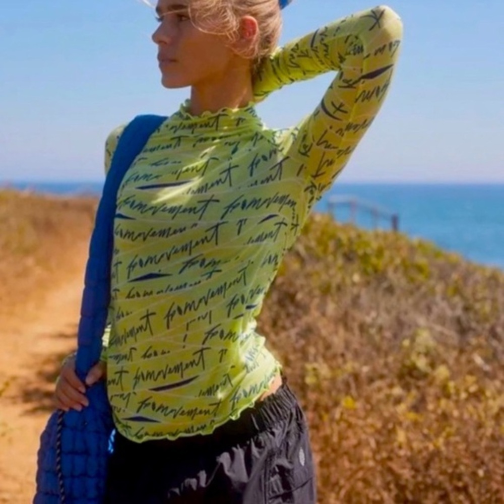 Free people Movement sz M lime green Printed Logo High Jump long Sleeve knit top